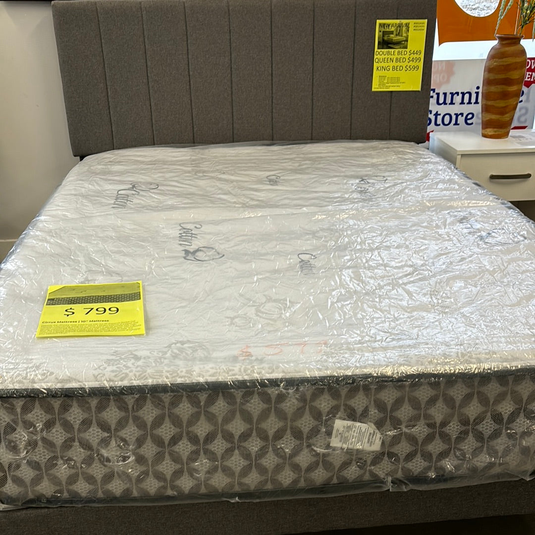 Grey queen bed includes mattress support